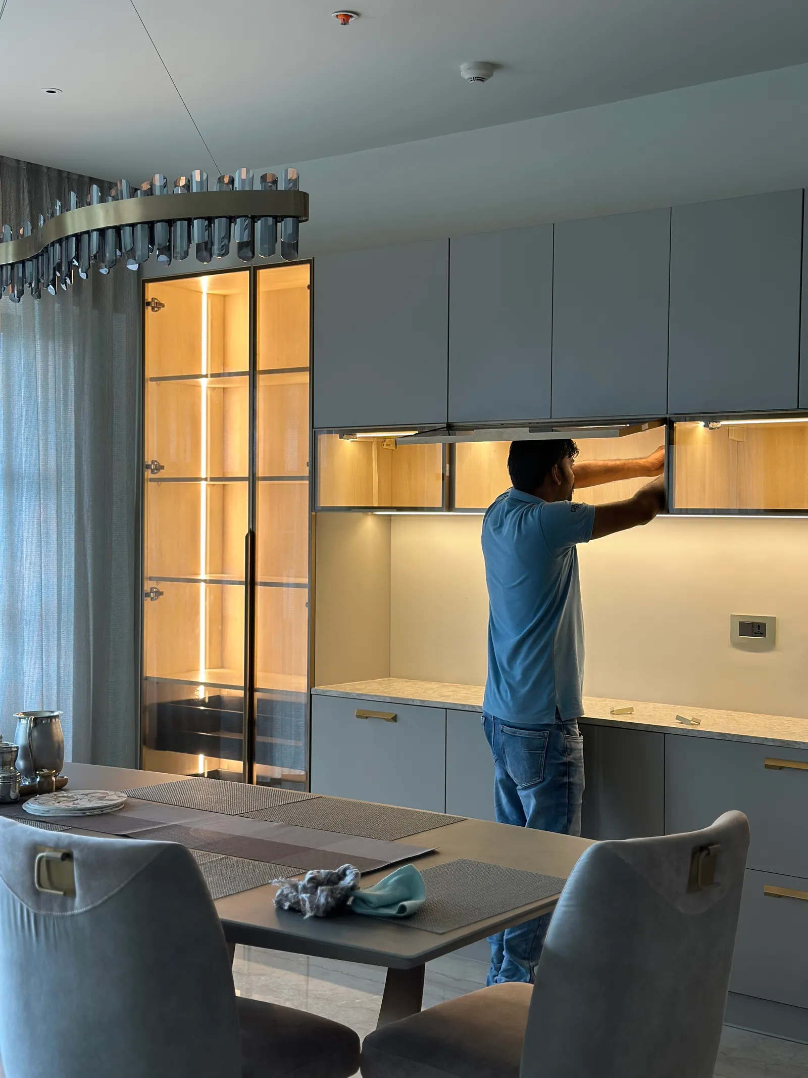 Crockery unit being installed in the dining room — Seema Katta Crockery
